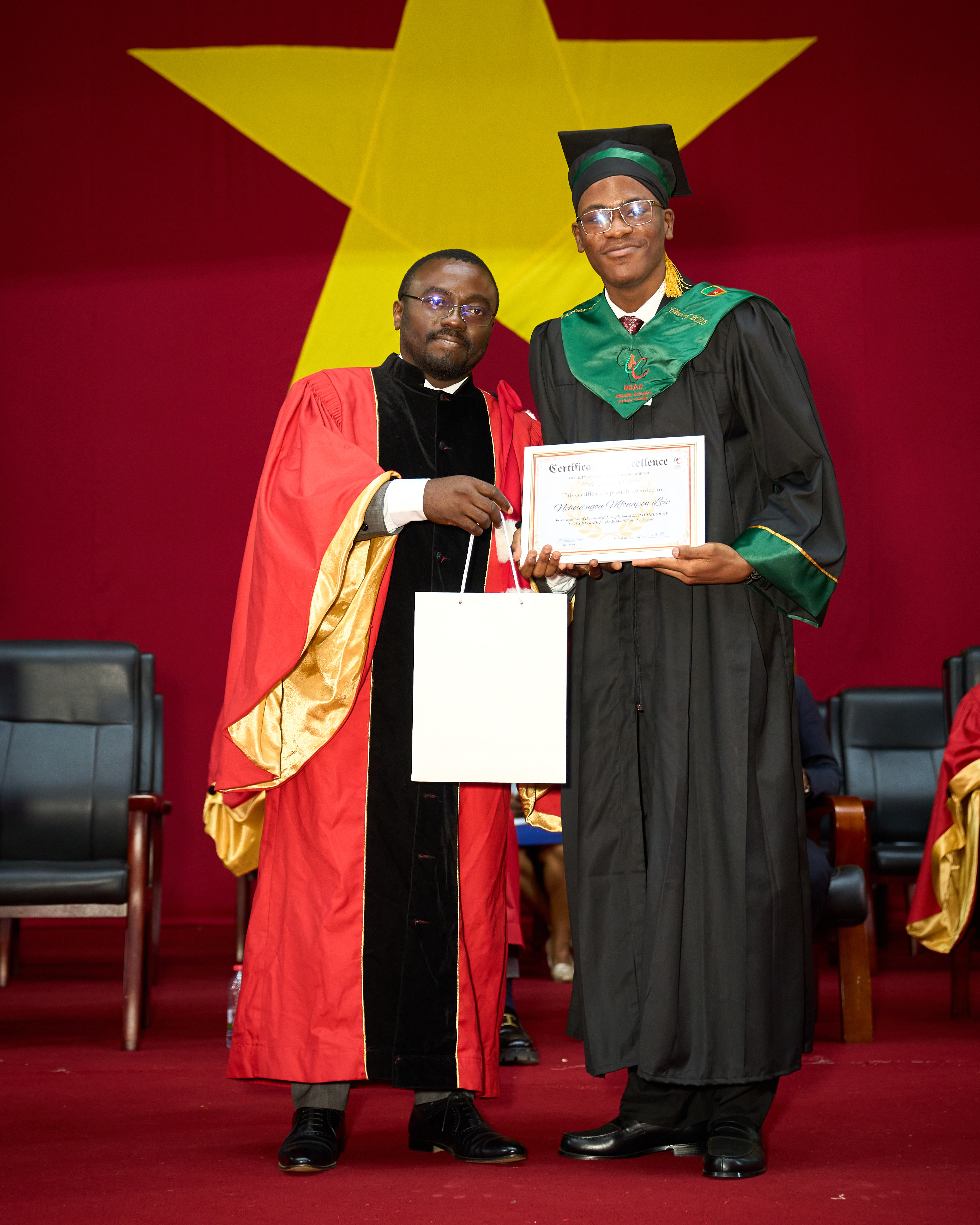 UCAC Graduation - Charles Mfouapon receiving certificate